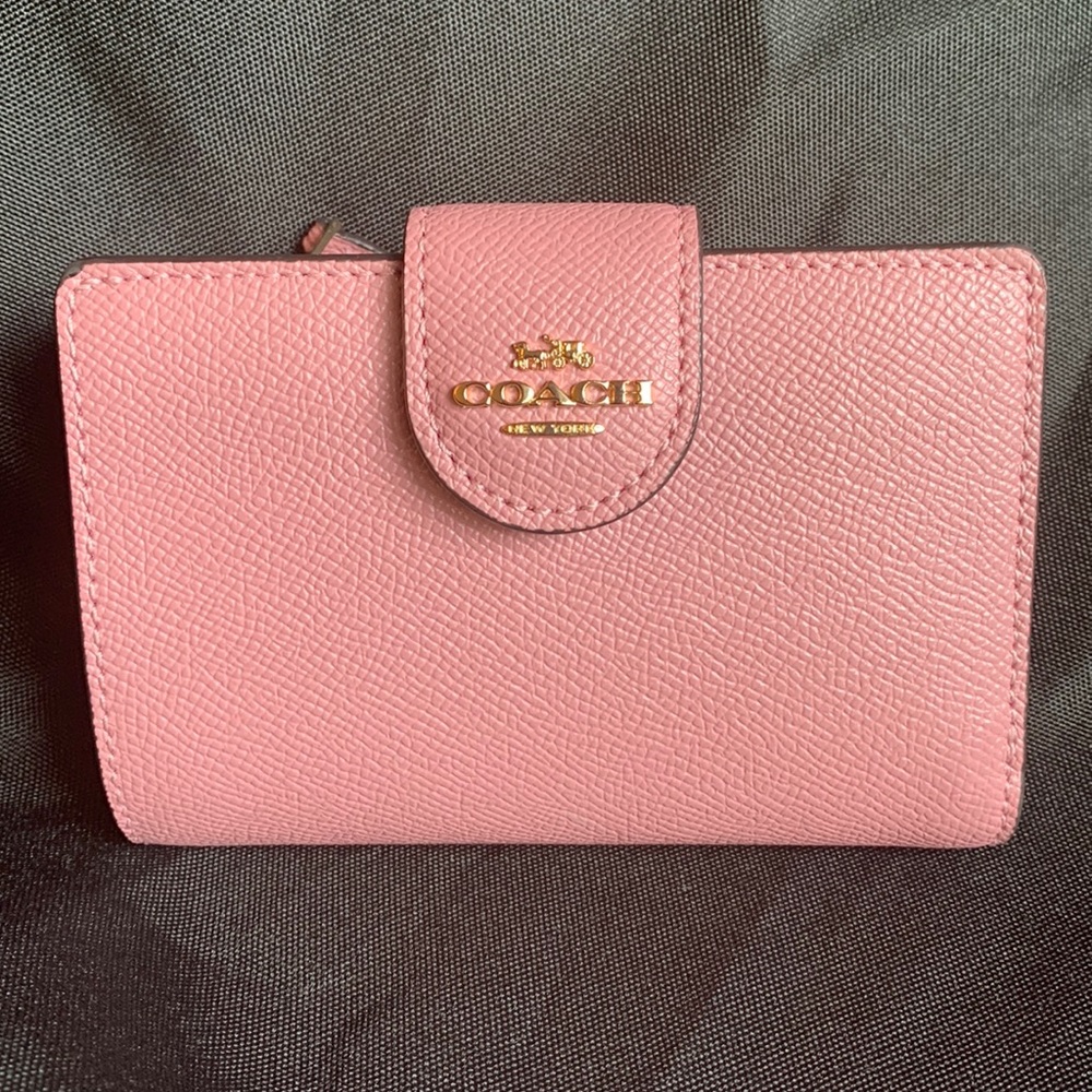 Gently used Coach Wallet color is Gold/True Pink